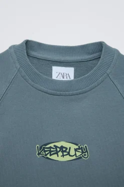 Niños ZARA 6 - 14 Años·Camisetas<CAMISETA ACID WASH ESTAMPADO